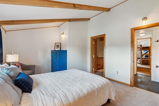 carpeted bedroom featuring baseboards and lofted ceiling with beams