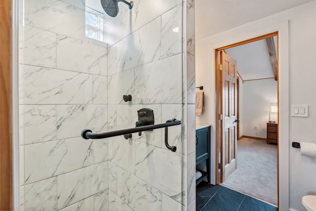bathroom with a shower stall and toilet