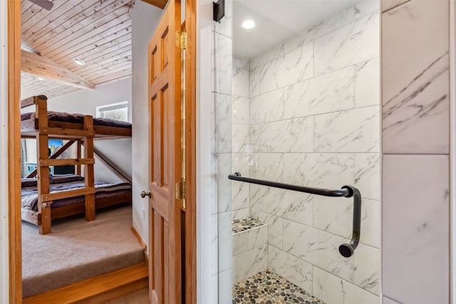 bathroom featuring ensuite bath, wooden ceiling, vaulted ceiling, and a stall shower