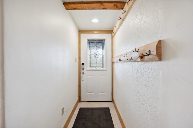 doorway to outside with recessed lighting, baseboards, and light tile patterned floors