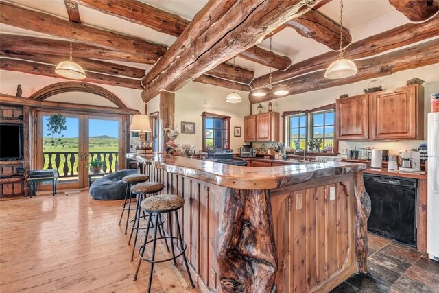 61020 County Road 129, Hahns Peak, CO 80428 - kitchen with black dishwasher, a breakfast bar, french doors, beamed ceiling, and a peninsula