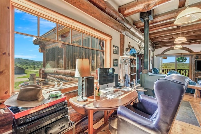 61020 County Road 129, Hahns Peak, CO 80428 - living room with beam ceiling, hardwood / wood-style floors, and a mountain view