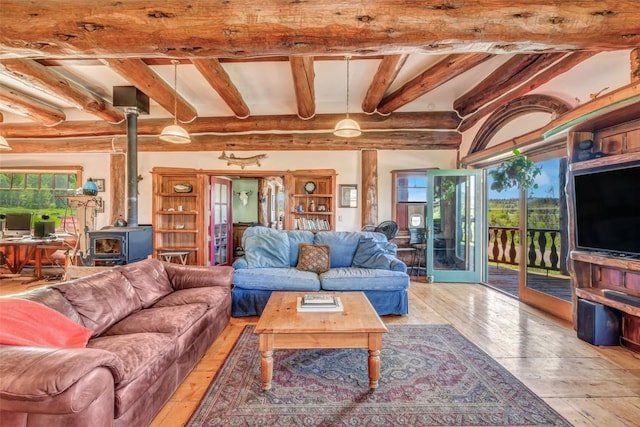 61020 County Road 129, Hahns Peak, CO 80428 - living area with a wood stove, light wood-style floors, and beamed ceiling