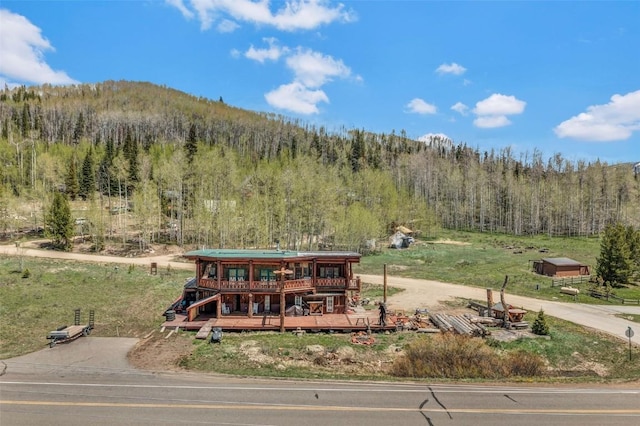 61020 County Road 129, Hahns Peak, CO 80428 - view of front facade featuring a forest view