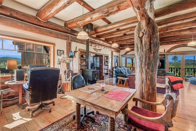 61020 County Road 129, Hahns Peak, CO 80428 - home office with french doors, wood-type flooring, beam ceiling, a wood stove, and plenty of natural light