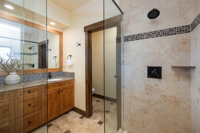 310 S 8th Ave Unit 4, Frisco, CO 80443 - full bathroom with a stall shower, decorative backsplash, vanity, baseboards, and toilet