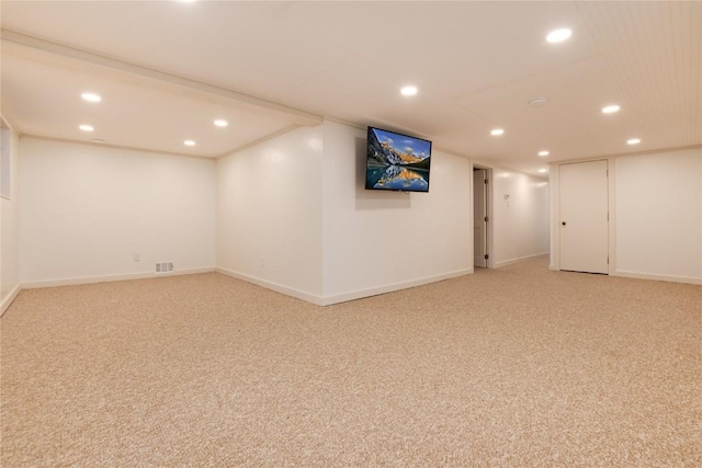 finished basement with recessed lighting, visible vents, and light colored carpet
