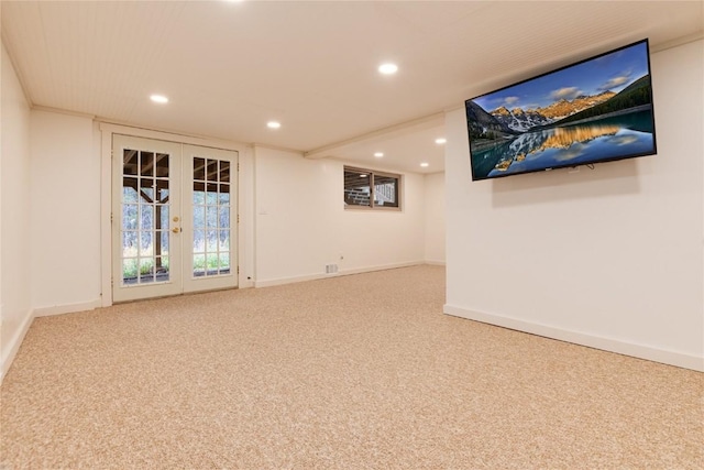 carpeted spare room featuring recessed lighting, baseboards, and french doors