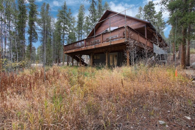 exterior space with stairway and a wooden deck