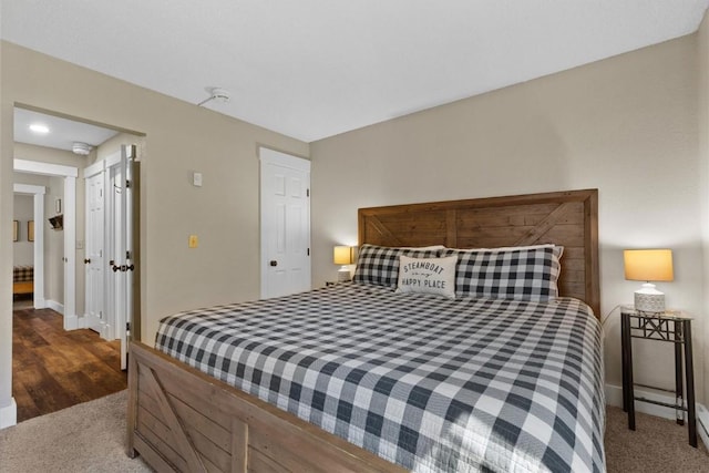 bedroom with baseboards and carpet floors
