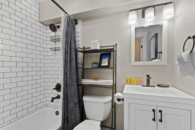 bathroom with toilet, a textured wall, shower / tub combo, and vanity