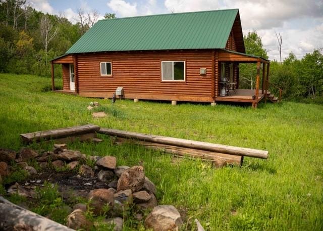 80 Sapling Ln, Craig, CO 81625 - view of side of property with a yard, a deck, and a metal roof