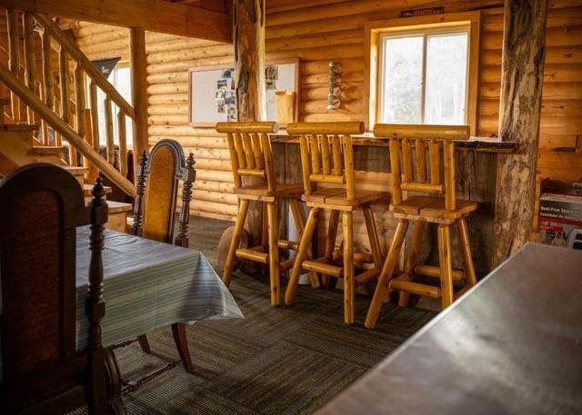 80 Sapling Ln, Craig, CO 81625 - dining space featuring rustic walls and stairway