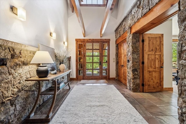 240 Two Cabins Dr, Silverthorne, CO 80498 - entryway featuring beam ceiling, stone tile flooring, and high vaulted ceiling