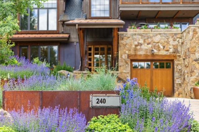 240 Two Cabins Dr, Silverthorne, CO 80498 - exterior space featuring a garage, stone siding, and driveway