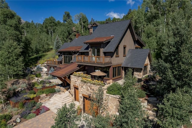 240 Two Cabins Dr, Silverthorne, CO 80498 - back of property featuring roof with shingles and a chimney