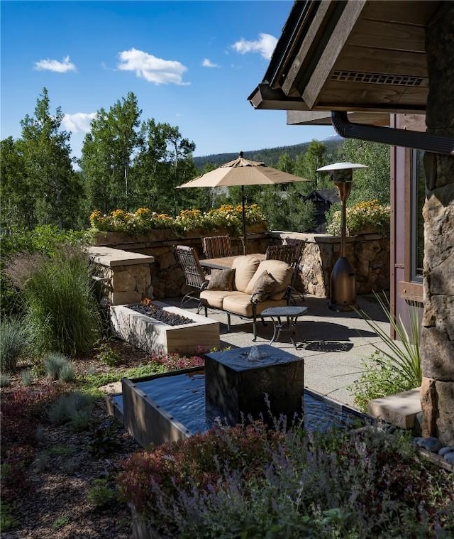 240 Two Cabins Dr, Silverthorne, CO 80498 - view of patio / terrace featuring an outdoor living space with a fire pit