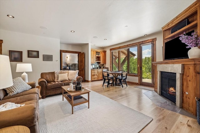 240 Two Cabins Dr, Silverthorne, CO 80498 - living area featuring light wood-style floors, a high end fireplace, and recessed lighting