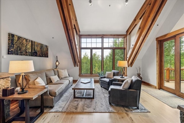 240 Two Cabins Dr, Silverthorne, CO 80498 - living room featuring wood finished floors and high vaulted ceiling