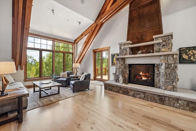 240 Two Cabins Dr, Silverthorne, CO 80498 - living area with a fireplace, wood finished floors, and high vaulted ceiling