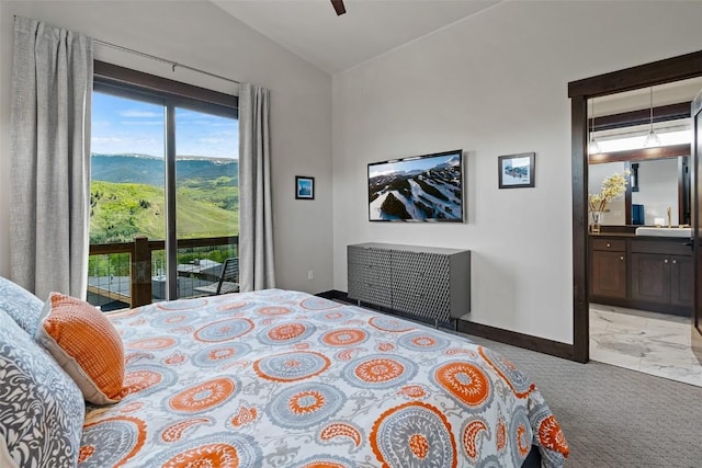 18 Lena Way, Silverthorne, CO 80498 - carpeted bedroom with access to exterior, lofted ceiling, baseboards, ensuite bath, and a ceiling fan