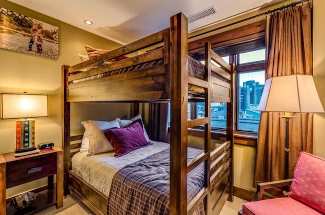 carpeted bedroom featuring visible vents and recessed lighting