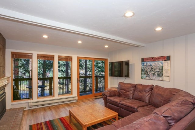 805 Columbine Rd Unit 105, Breckenridge, CO 80424 - living room featuring wood finished floors, a baseboard heating unit, a glass covered fireplace, beamed ceiling, and recessed lighting