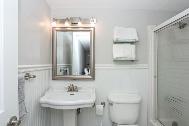 805 Columbine Rd Unit 105, Breckenridge, CO 80424 - bathroom featuring wainscoting, a shower stall, and toilet
