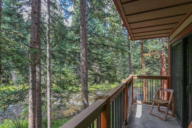805 Columbine Rd Unit 105, Breckenridge, CO 80424 - balcony featuring a wooded view