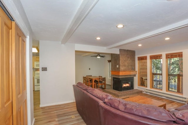 805 Columbine Rd Unit 105, Breckenridge, CO 80424 - living area with light wood finished floors, baseboard heating, baseboards, and beam ceiling