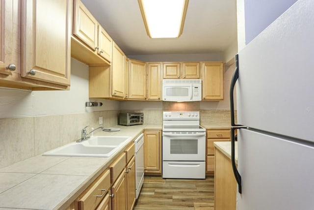 805 Columbine Rd Unit 105, Breckenridge, CO 80424 - kitchen with light wood-style floors, light brown cabinetry, a sink, and white appliances
