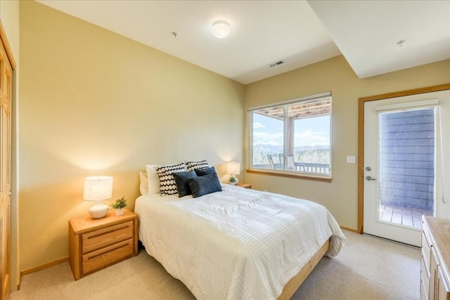 81 Cydney Ln Unit 81A, Silverthorne, CO 80498 - bedroom featuring light carpet, baseboards, and access to exterior