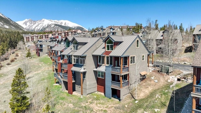 81 Cydney Ln Unit 81A, Silverthorne, CO 80498 - rear view of house featuring metal roof, a standing seam roof, a mountain view, and a residential view