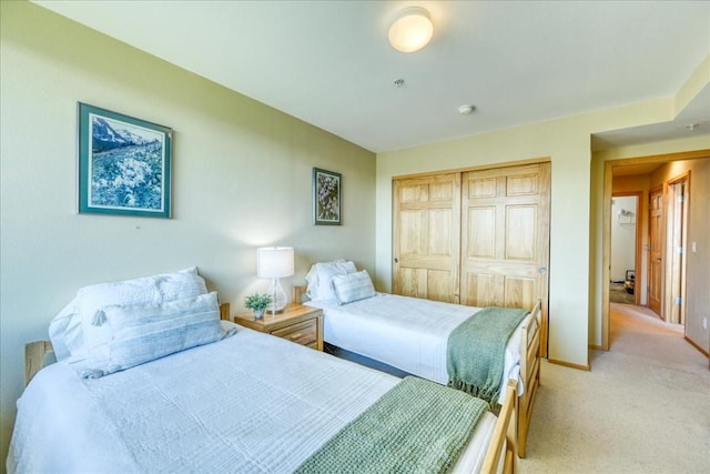 81 Cydney Ln Unit 81A, Silverthorne, CO 80498 - bedroom featuring light carpet, a closet, and baseboards