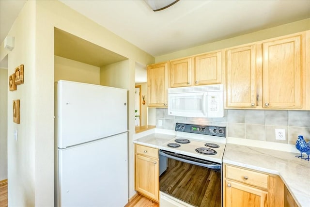 81 Cydney Ln Unit 81A, Silverthorne, CO 80498 - kitchen with white appliances, light brown cabinets, decorative backsplash, light wood-type flooring, and light stone counters