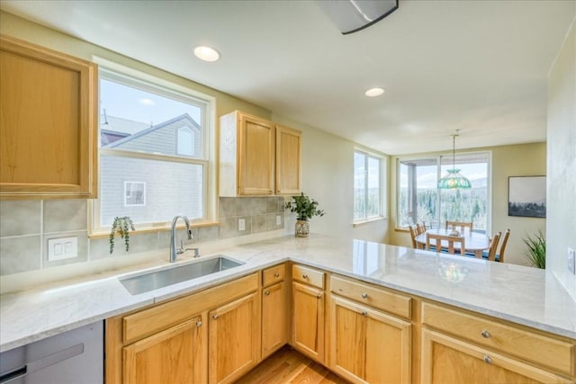 81 Cydney Ln Unit 81A, Silverthorne, CO 80498 - kitchen featuring a sink, light stone counters, backsplash, pendant lighting, and recessed lighting