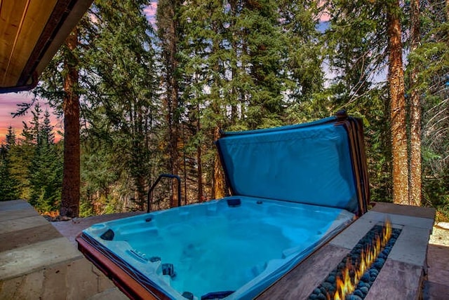 view of patio / terrace featuring a covered hot tub