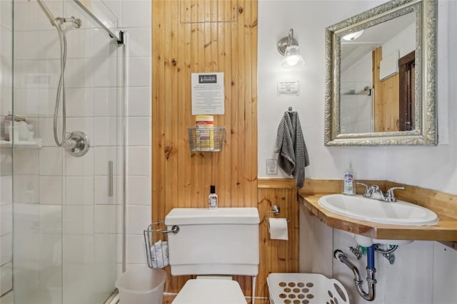 114 N French St, Breckenridge, CO 80424 - full bathroom with a stall shower, toilet, wood walls, and a sink