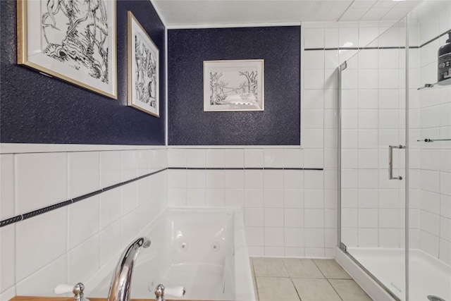 114 N French St, Breckenridge, CO 80424 - full bathroom with a stall shower, a jetted tub, tile walls, and tile patterned floors
