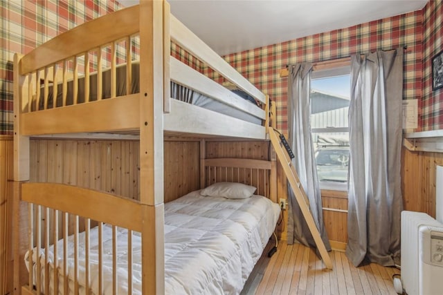 114 N French St, Breckenridge, CO 80424 - bedroom featuring wallpapered walls, hardwood / wood-style floors, and radiator heating unit