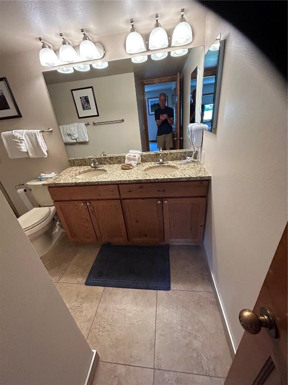 317 La Bonte St Unit 107, Dillon, CO 80435 - full bathroom with double vanity and tile patterned floors