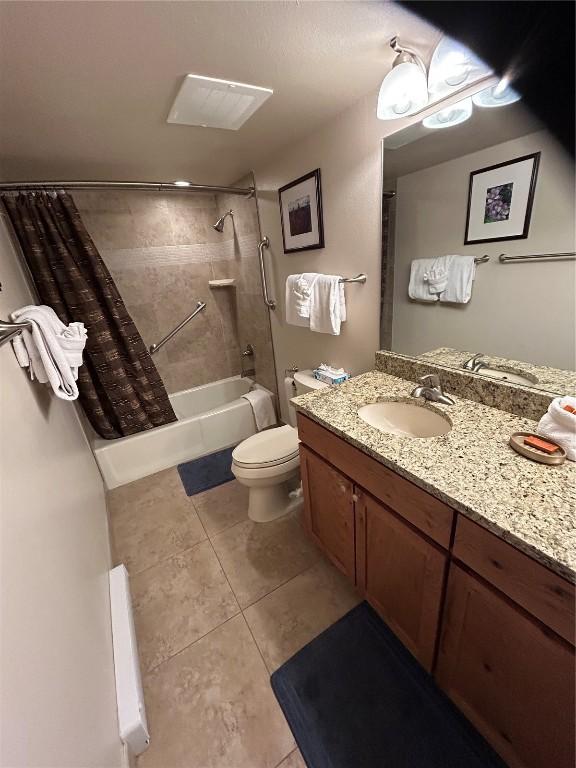 317 La Bonte St Unit 107, Dillon, CO 80435 - full bath featuring shower / bathtub combination with curtain, tile patterned flooring, and vanity