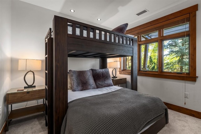 carpeted bedroom with baseboards, visible vents, and recessed lighting