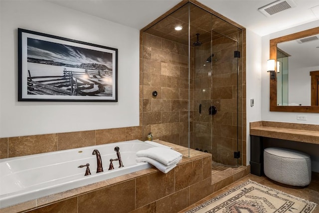 bathroom with a bath, vanity, visible vents, and a shower stall