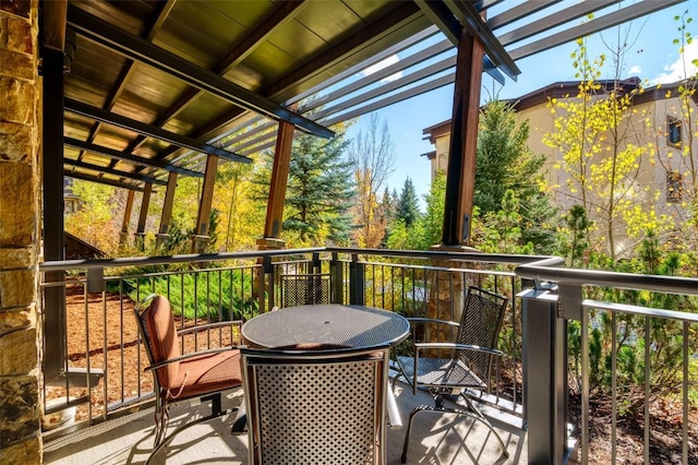 wooden terrace with outdoor dining space