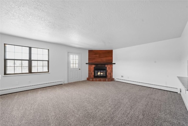 245 Straight Creek Dr Unit A, B, C, D, Dillon, CO 80435 - unfurnished living room featuring baseboard heating, a textured ceiling, a fireplace, and carpet floors