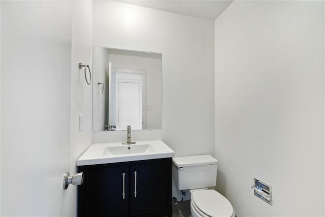 245 Straight Creek Dr Unit A, B, C, D, Dillon, CO 80435 - bathroom featuring toilet, vanity, and a textured ceiling