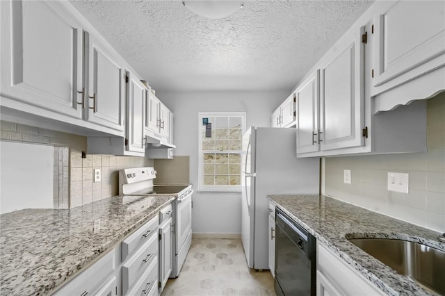245 Straight Creek Dr Unit A, B, C, D, Dillon, CO 80435 - kitchen with white electric range oven, black dishwasher, baseboards, backsplash, and light stone countertops