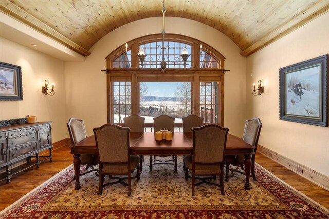 33800 Catamount Dr, Steamboat Springs, CO 80487 - dining area with vaulted ceiling, baseboards, and wood finished floors