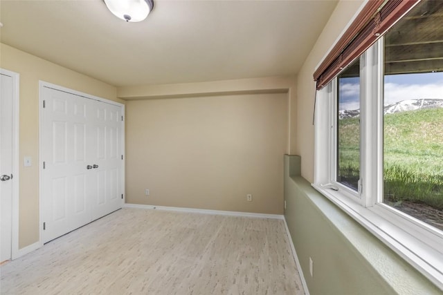 620 Parkview Dr Unit 61, Steamboat Springs, CO 80487 - unfurnished bedroom with wood finished floors and baseboards